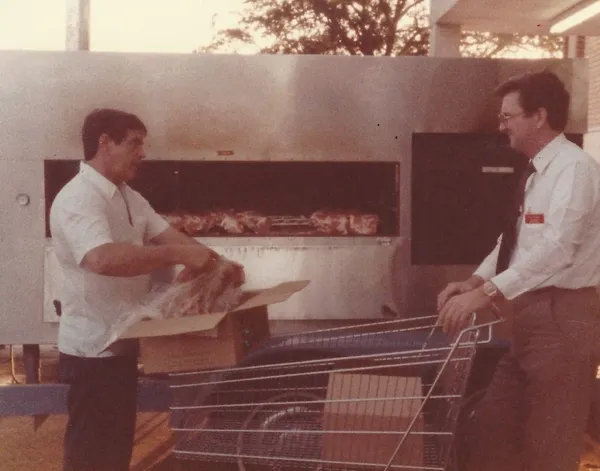 Loading meat into a smoker