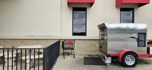 smoker on trailer infront of restaurant