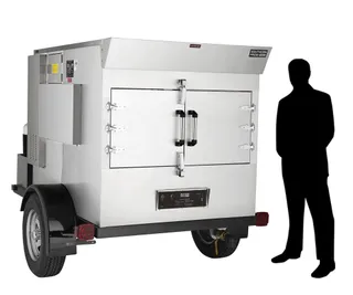 SPK-500 mobile smoker, right side, shown beside a person for scale