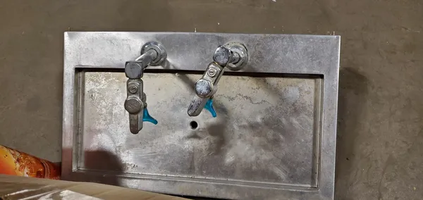 Used restaurant equipment 16: stainless steel wall panel with two faucet valves